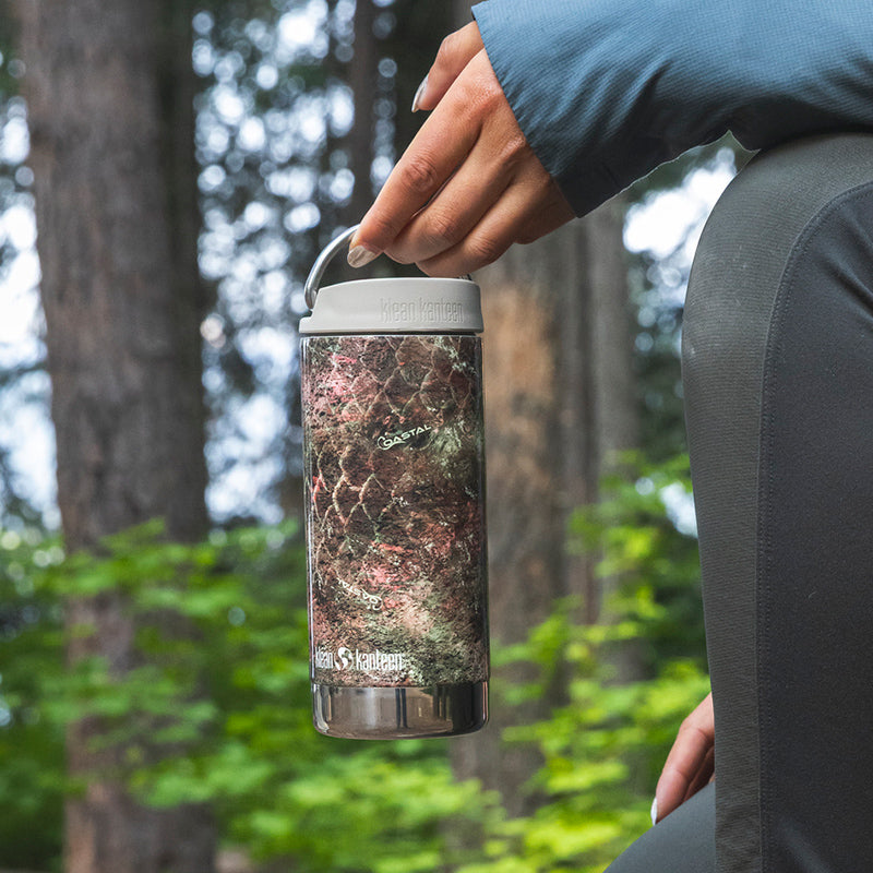 12oz-tkwide-with-twist-cap-mossy-oak-l7 12oz_tumbler_mossyoak_rainbowtrout_hand_closeup_square.jpg
