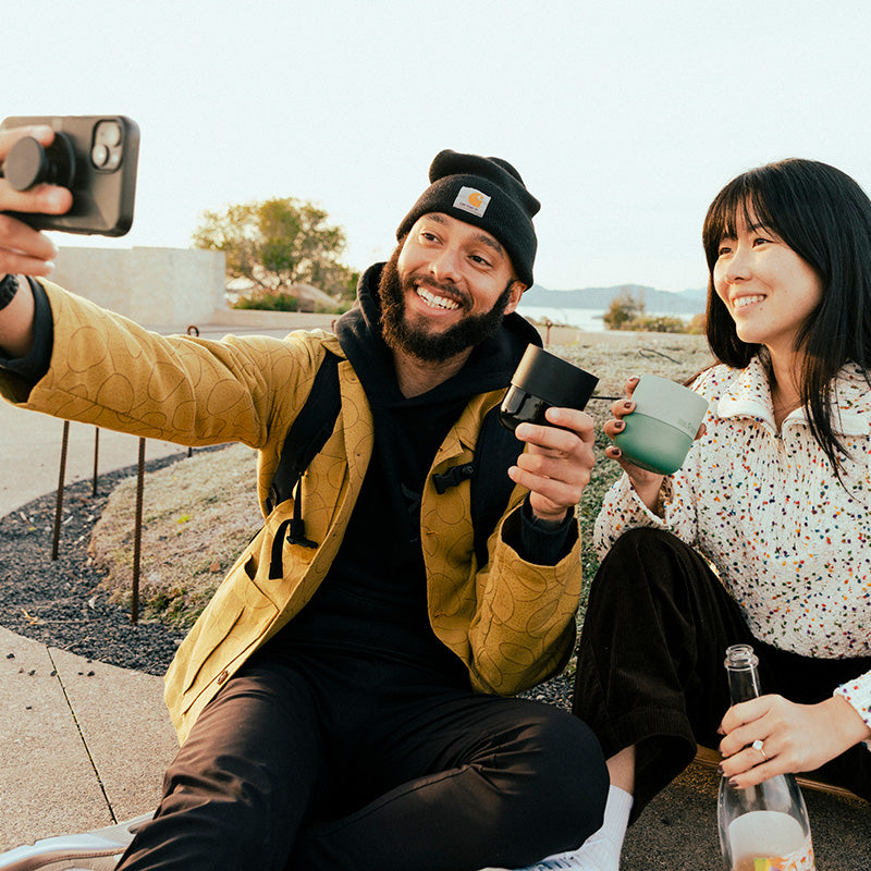 bring-your-own-party-kit-tumblers-and-cocktails-a6 8oz_rise_lowball_black_iceberg_couple_selfie_city_square.jpg