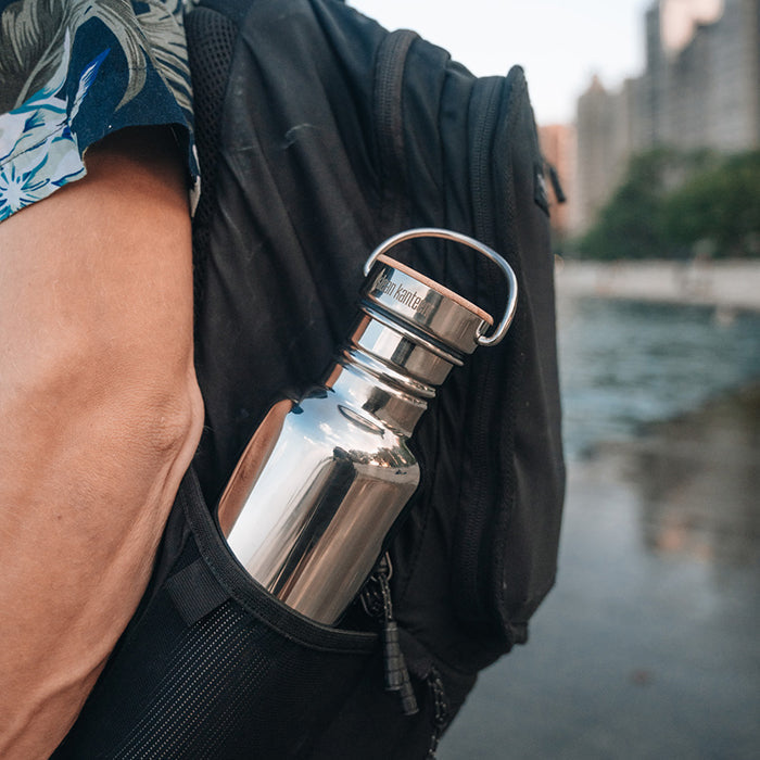 27oz-reflect-with-bamboo-cap-m3 K27SSLRF-MS-BAMBOO_reflect-bottle_backpack_lifestyle.jpg